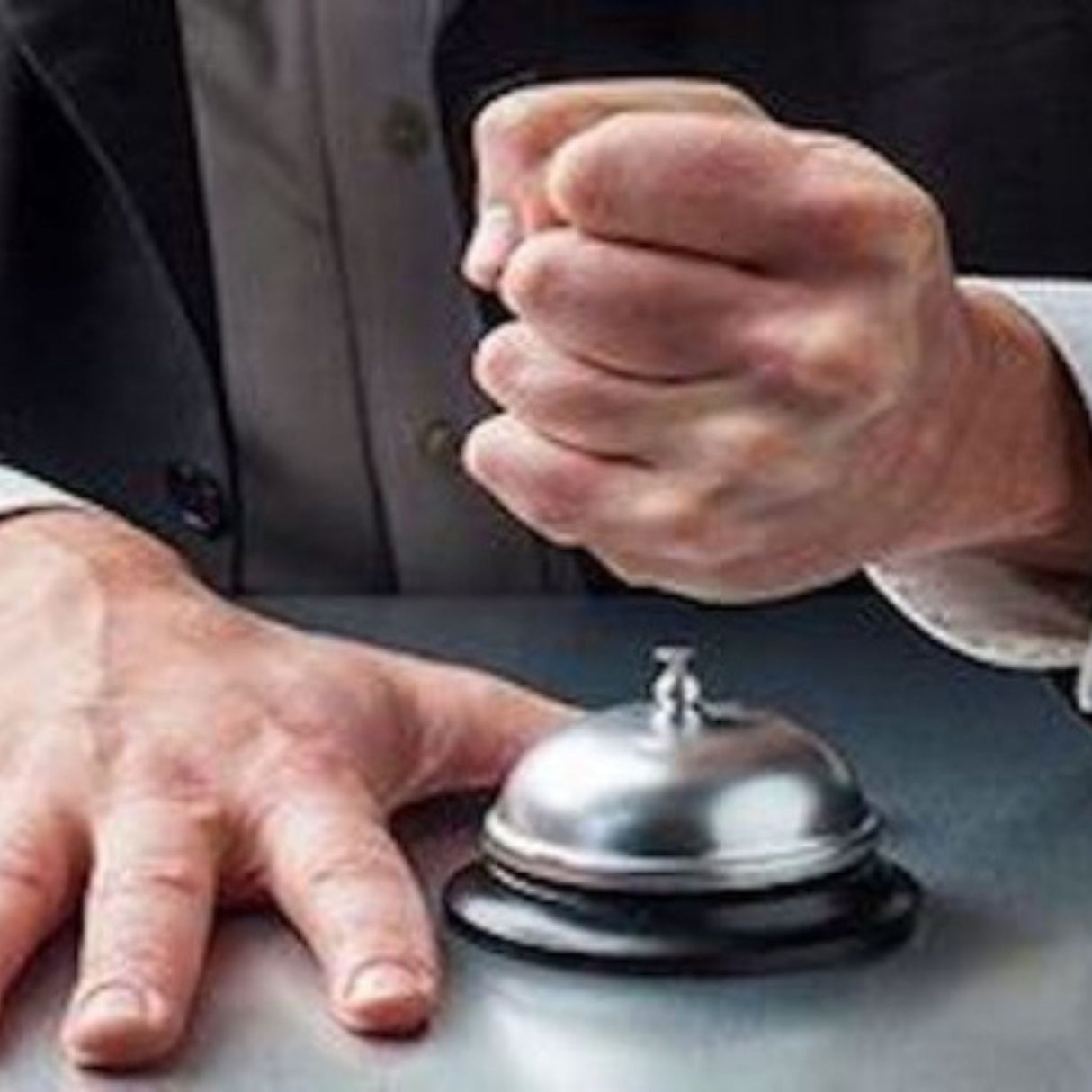 angry customer hitting desk bell