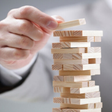 business man moving game pieces