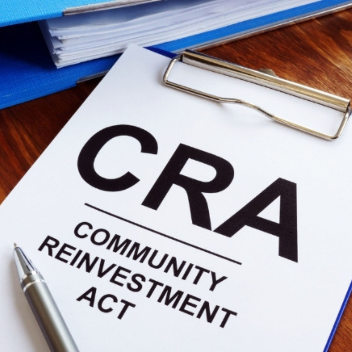 Paperwork with 'CRA Community Reinvestment Act' text.