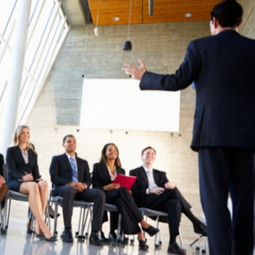 professional speaker in front of crowd