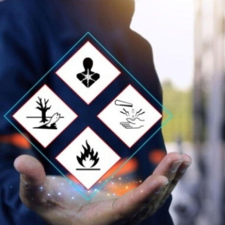 Hand holding a digital display with hazard symbols 