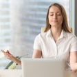 women meditating at desk