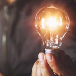 holding lightbulb