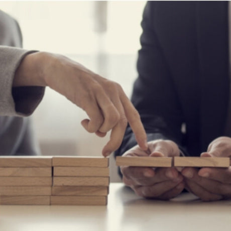 managers moving board pieces